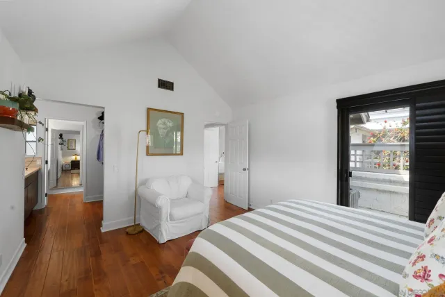 a bedroom with double bed and a window