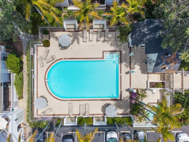 a view of a swimming pool with outdoor seating