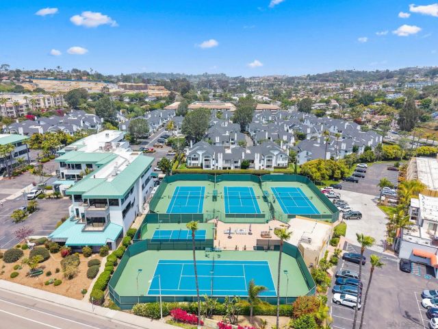 a view of a swimming pool with a yard