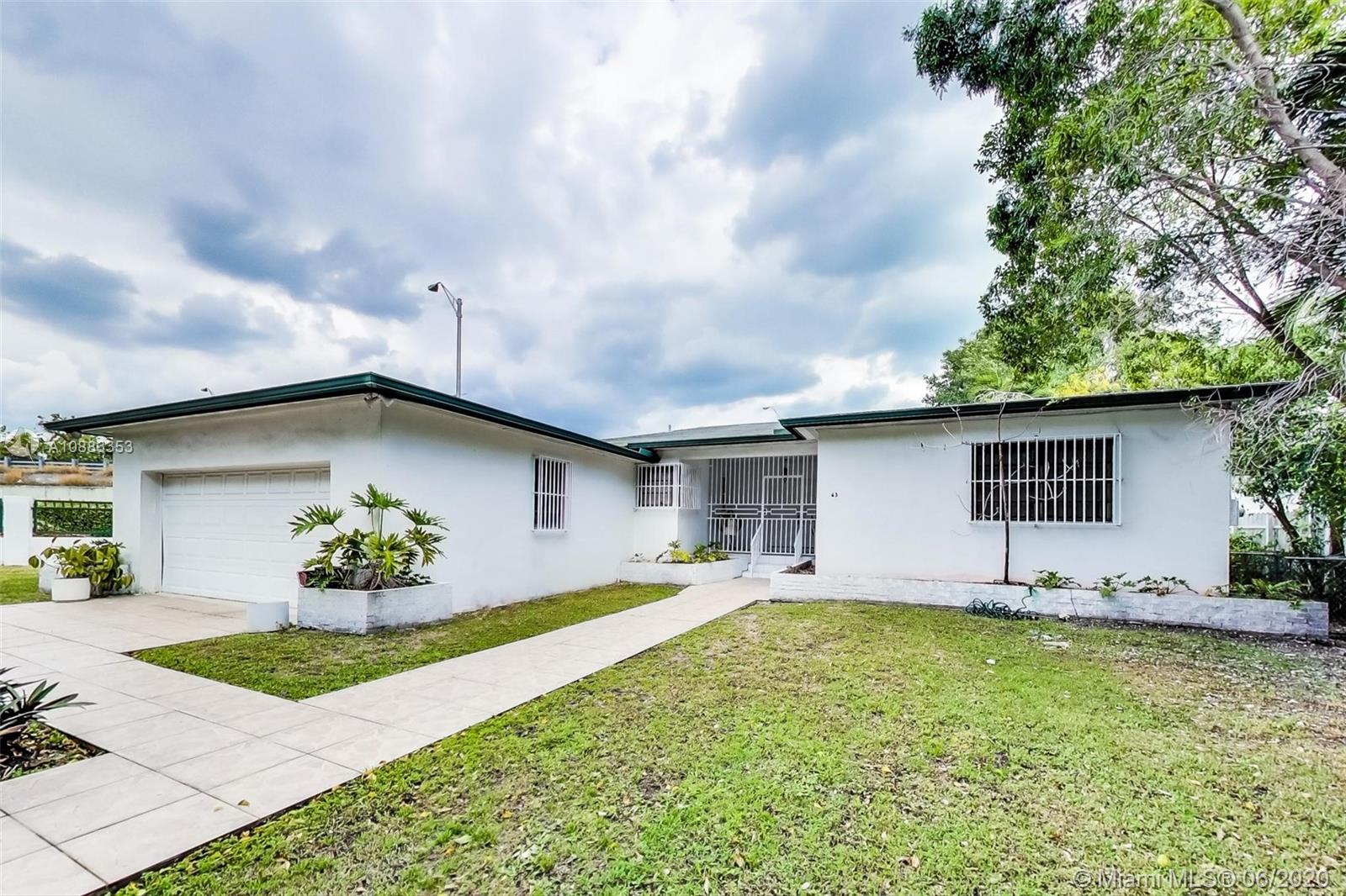 63 Southwest 31st Road Miami, FL 33129 - Photo 2 of 34 a house view with a garden space