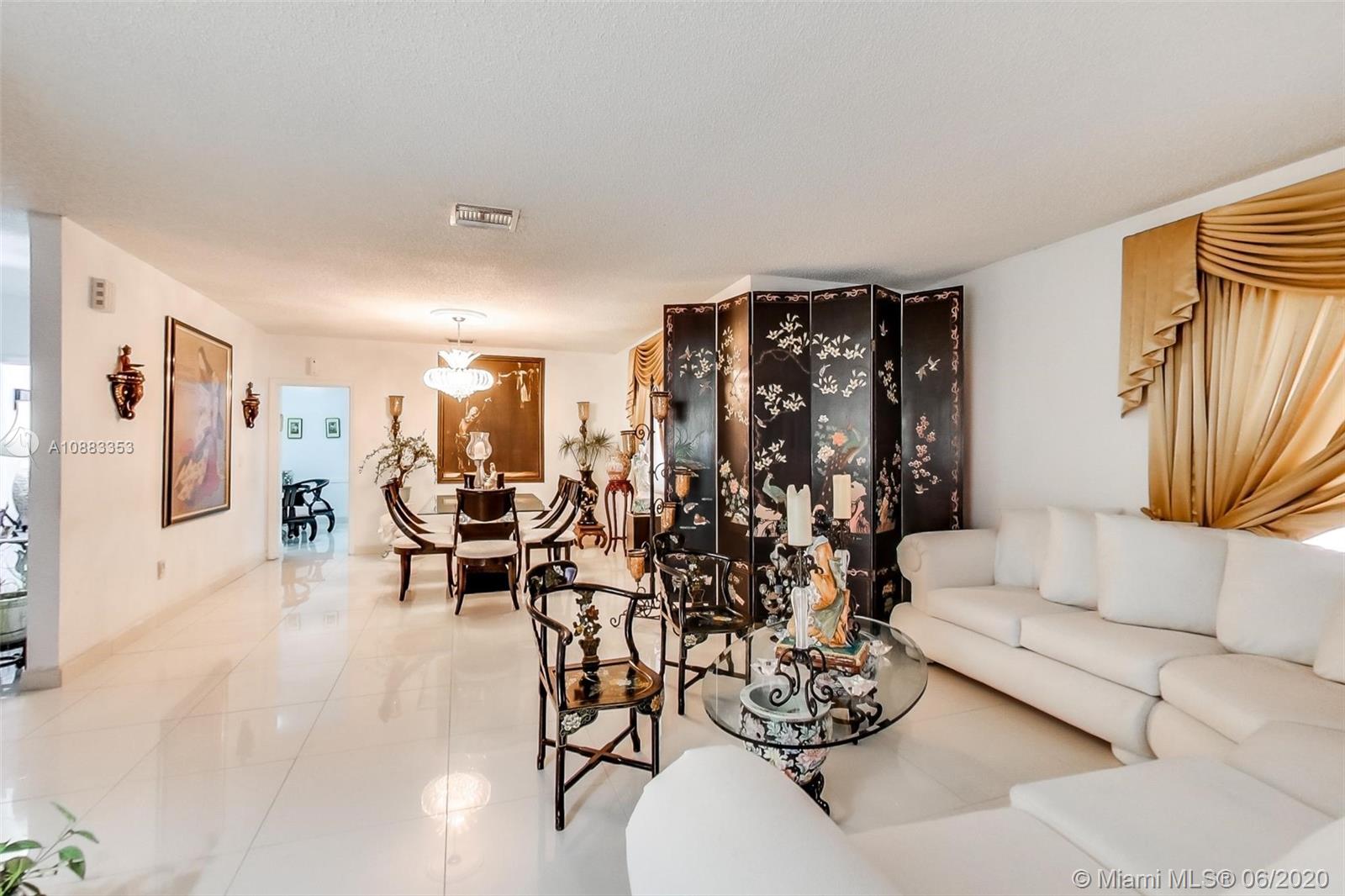 63 Southwest 31st Road Miami, FL 33129 - Photo 12 of 34 a living room with furniture and large windows
