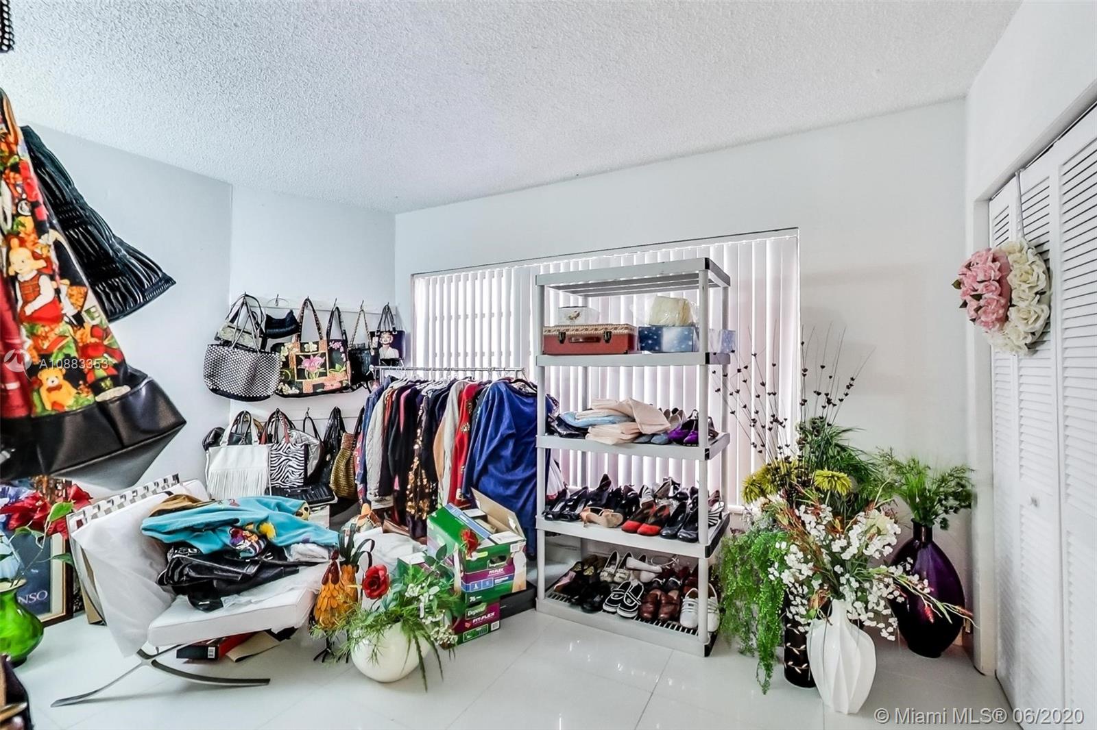 63 Southwest 31st Road Miami, FL 33129 - Photo 13 of 34 a bedroom with furniture and a fan