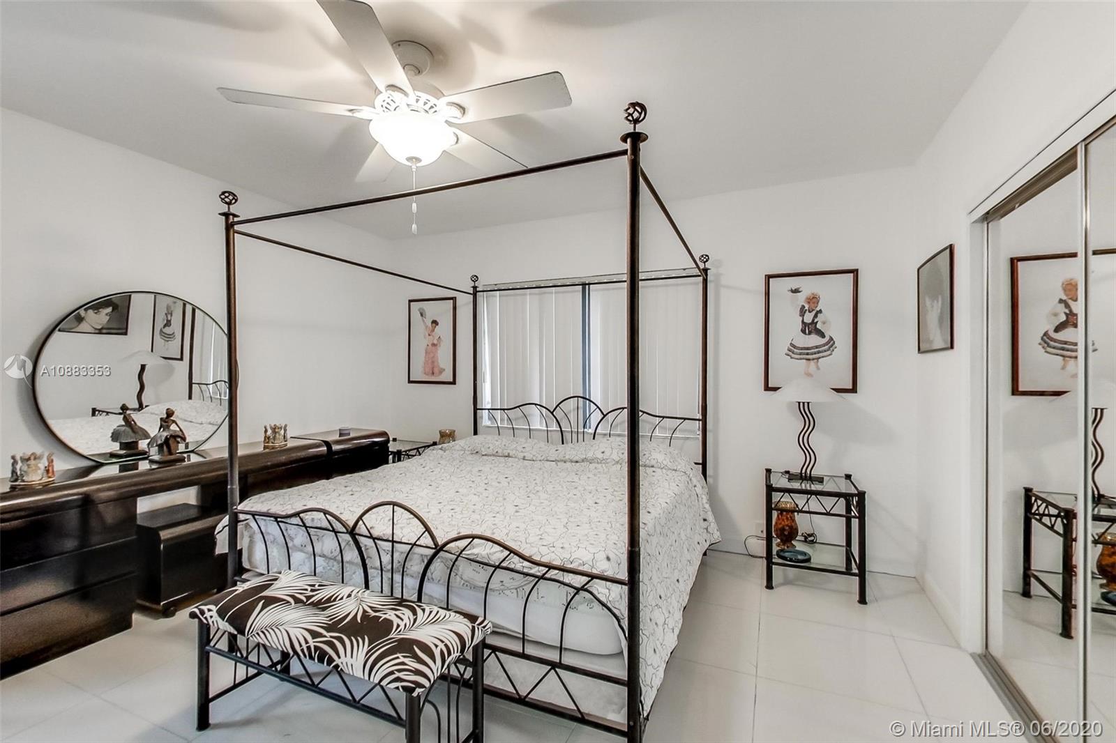 63 Southwest 31st Road Miami, FL 33129 - Photo 23 of 34 a bedroom with furniture and a chandelier
