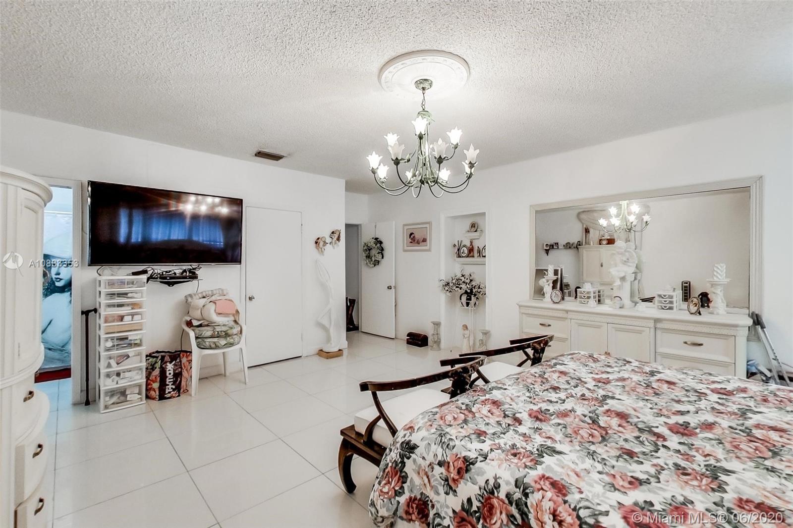 63 Southwest 31st Road Miami, FL 33129 - Photo 26 of 34 a living room with furniture and a flat screen tv