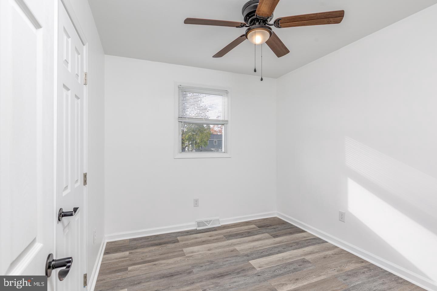 238 West Center Street Clayton, NJ 08312 - Photo 13 of 30 a view of room with a ceiling fan and wooden floor