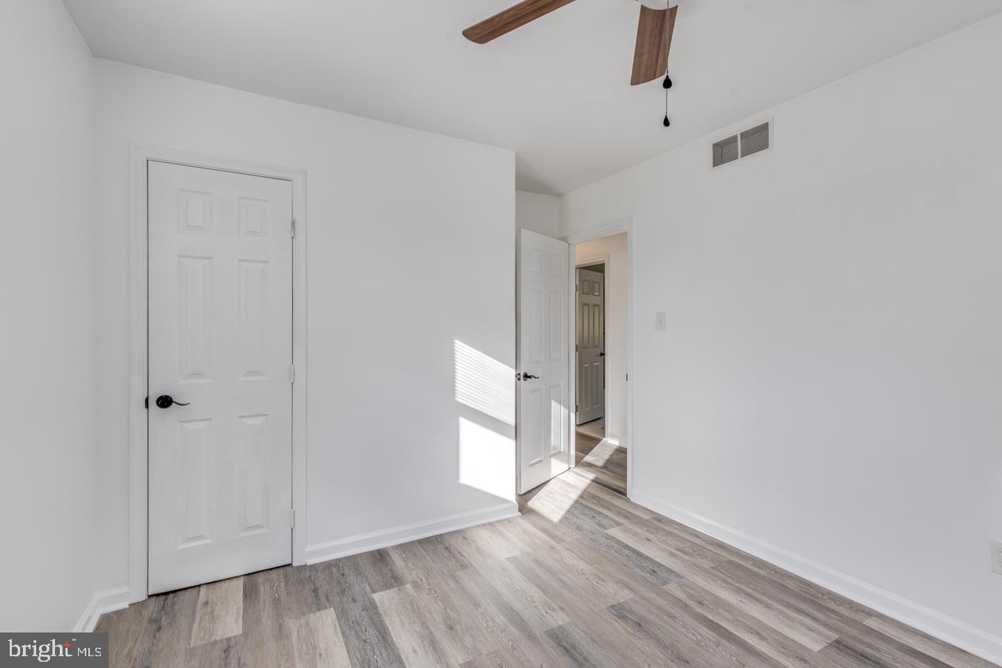 238 West Center Street Clayton, NJ 08312 - Photo 16 of 30 an empty room with wooden floor