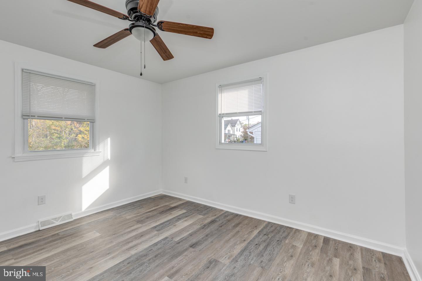 238 West Center Street Clayton, NJ 08312 - Photo 17 of 30 wooden floor in an empty room with a window
