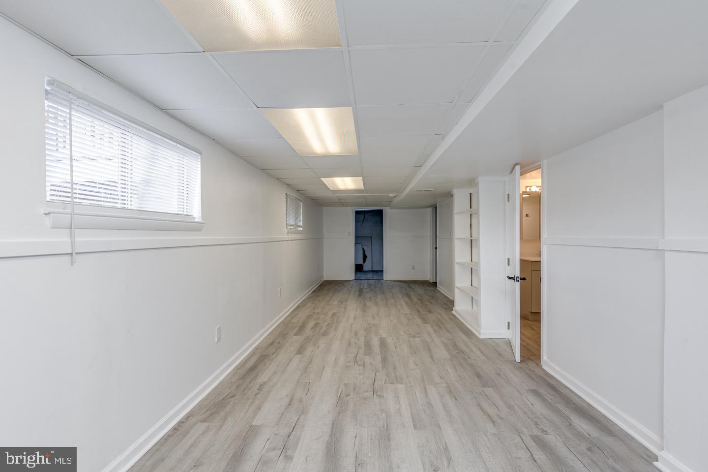 238 West Center Street Clayton, NJ 08312 - Photo 20 of 30 a view of a room with wooden floor closet and windows
