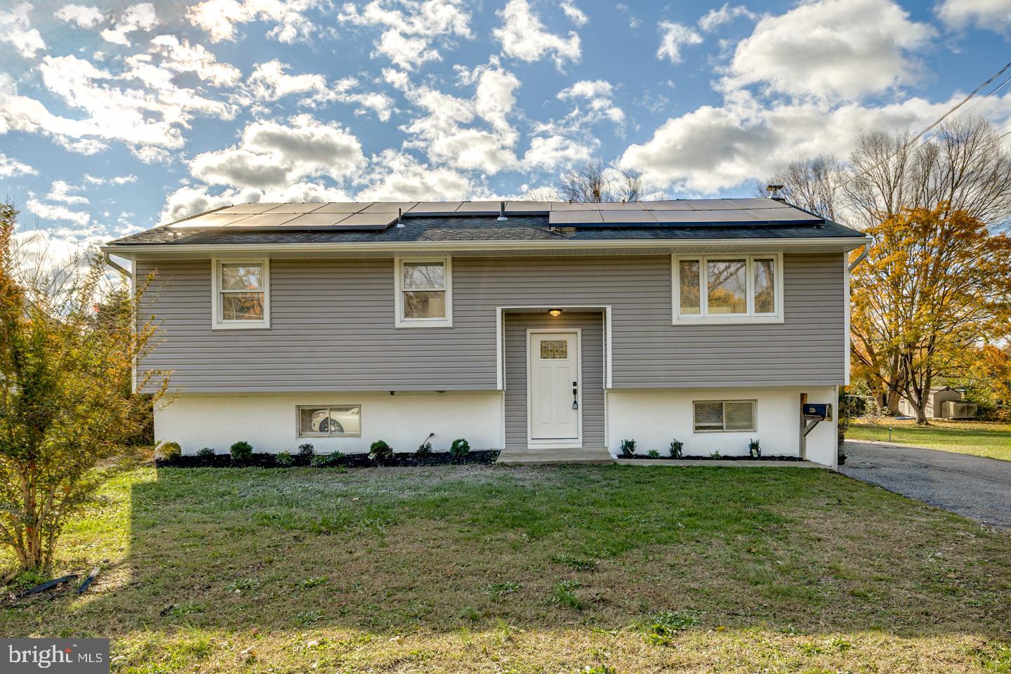 238 West Center Street Clayton, NJ 08312 - Photo 2 of 30 a front view of a house with a garden