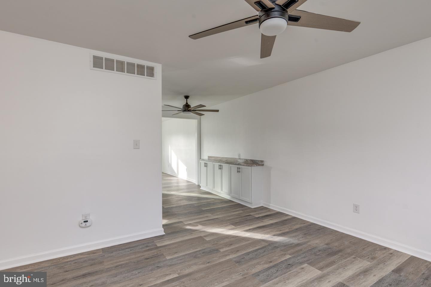 238 West Center Street Clayton, NJ 08312 - Photo 4 of 30 a view of a livingroom with a ceiling fan and wooden floor
