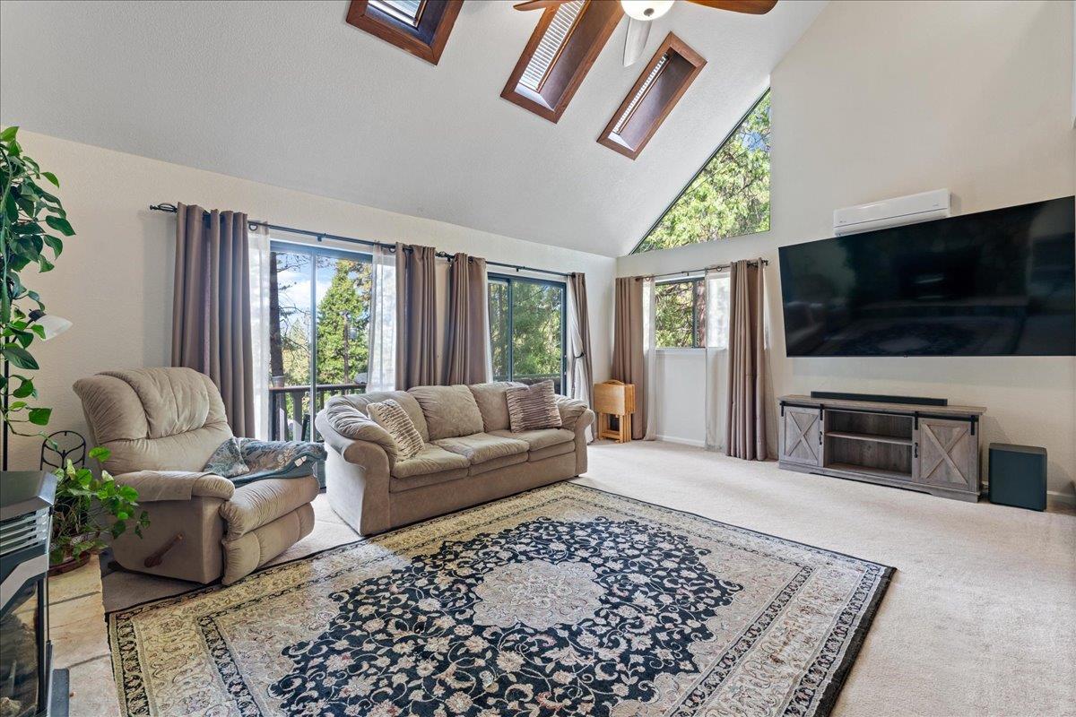 5360 Pine Ridge Drive Grizzly Flats, CA 95636 - Photo 11 of 36 a living room with furniture and a flat screen tv