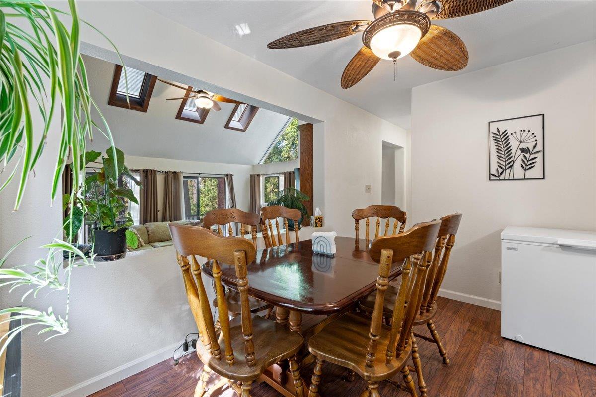 5360 Pine Ridge Drive Grizzly Flats, CA 95636 - Photo 13 of 36 a view of a dining room with furniture and wooden floor