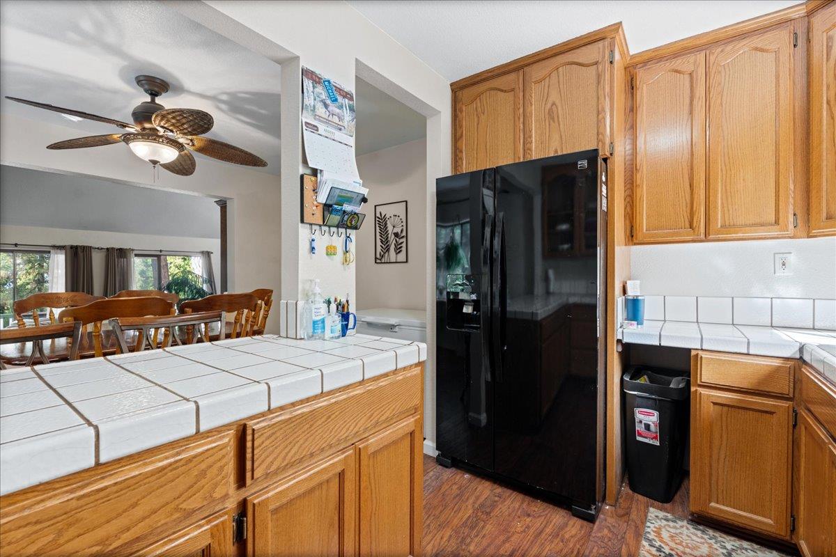 5360 Pine Ridge Drive Grizzly Flats, CA 95636 - Photo 15 of 36 a kitchen with stainless steel appliances a refrigerator and a stove top oven