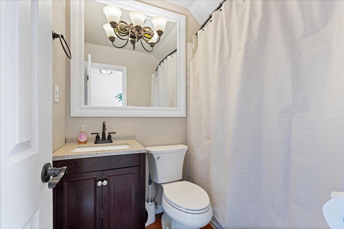 5360 Pine Ridge Drive Grizzly Flats, CA 95636 - Photo 18 of 36 a bathroom with a toilet sink and mirror