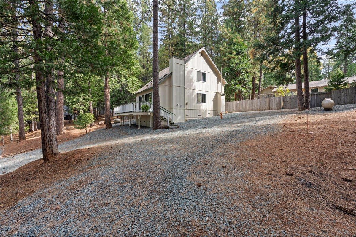 5360 Pine Ridge Drive Grizzly Flats, CA 95636 - Photo 34 of 36 a view of a house with a yard and large trees