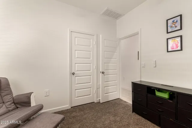 a view of room with furniture and a ceiling fan
