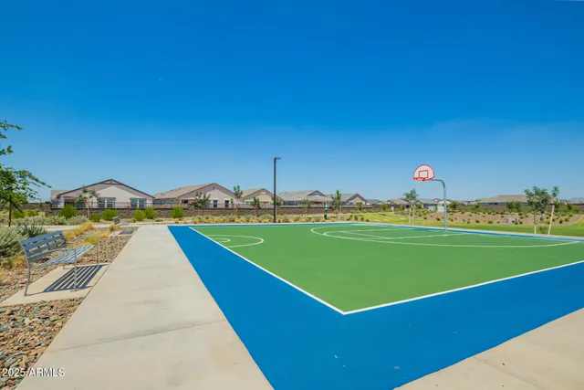 a view of a swimming pool with a lawn chairs and swimming pool