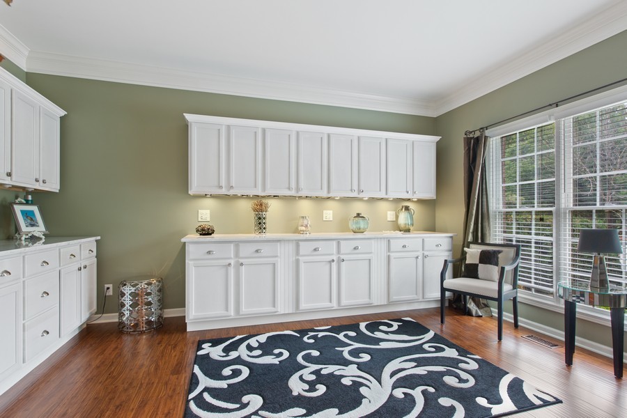 1 Walnut Lane Sugar Grove, IL 60554 - Photo 11 of 35 a kitchen with granite countertop a sink and wooden cabinets