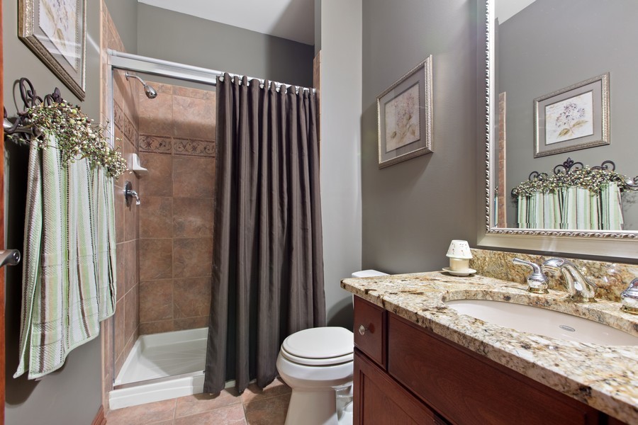 1 Walnut Lane Sugar Grove, IL 60554 - Photo 12 of 35 a bathroom with a granite countertop sink toilet and shower