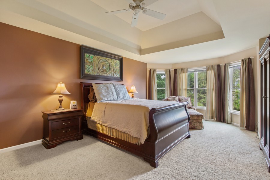 1 Walnut Lane Sugar Grove, IL 60554 - Photo 13 of 35 a spacious bedroom with a bed and a chandelier