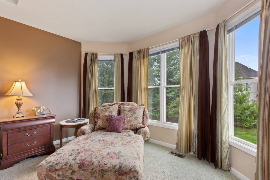 1 Walnut Lane Sugar Grove, IL 60554 - Photo 15 of 35 a bedroom with a bed and large windows