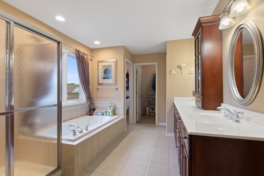 1 Walnut Lane Sugar Grove, IL 60554 - Photo 16 of 35 a bathroom with a tub sink and mirror