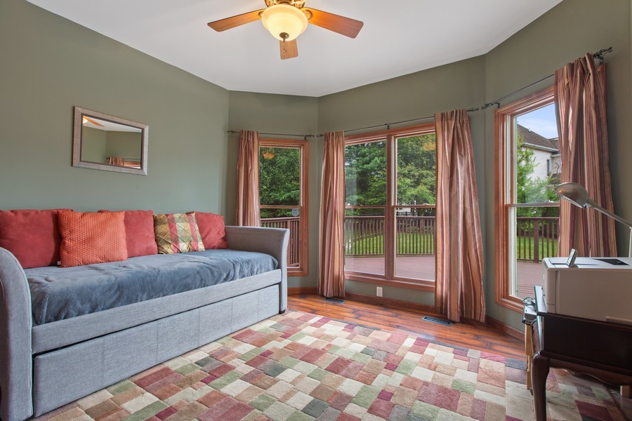 1 Walnut Lane Sugar Grove, IL 60554 - Photo 18 of 35 a living room with a large bed and a large window