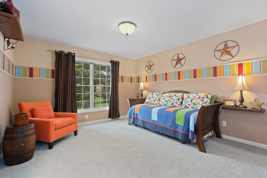 1 Walnut Lane Sugar Grove, IL 60554 - Photo 19 of 35 a bedroom with bed and glass windows