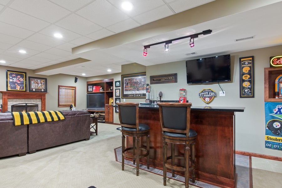 1 Walnut Lane Sugar Grove, IL 60554 - Photo 22 of 35 a living room with furniture and a flat screen tv