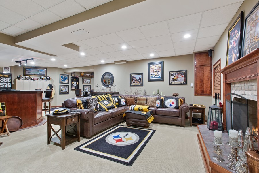 1 Walnut Lane Sugar Grove, IL 60554 - Photo 23 of 35 a living room with furniture a fireplace and a large window