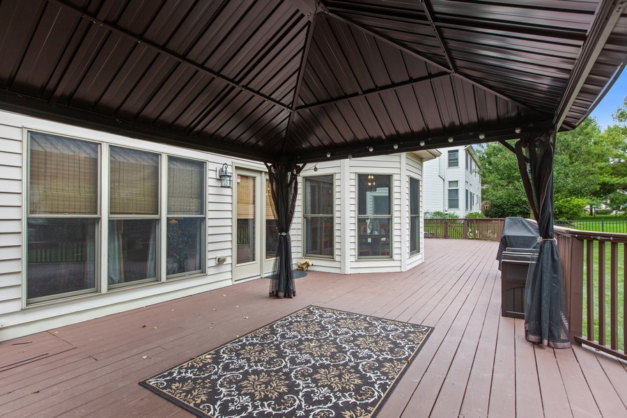 1 Walnut Lane Sugar Grove, IL 60554 - Photo 28 of 35 a view of a two chairs in the deck under an umbrella