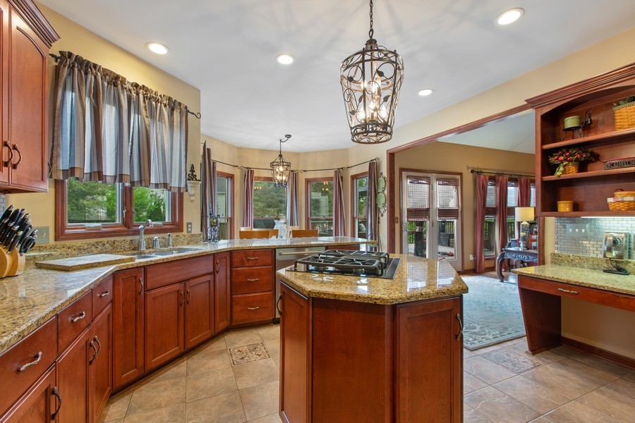 1 Walnut Lane Sugar Grove, IL 60554 - Photo 6 of 35 a kitchen with a sink stove and cabinets