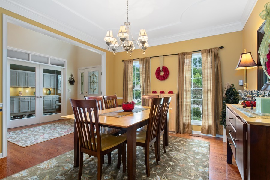 1 Walnut Lane Sugar Grove, IL 60554 - Photo 9 of 35 a view of a dining room with furniture window and wooden floor