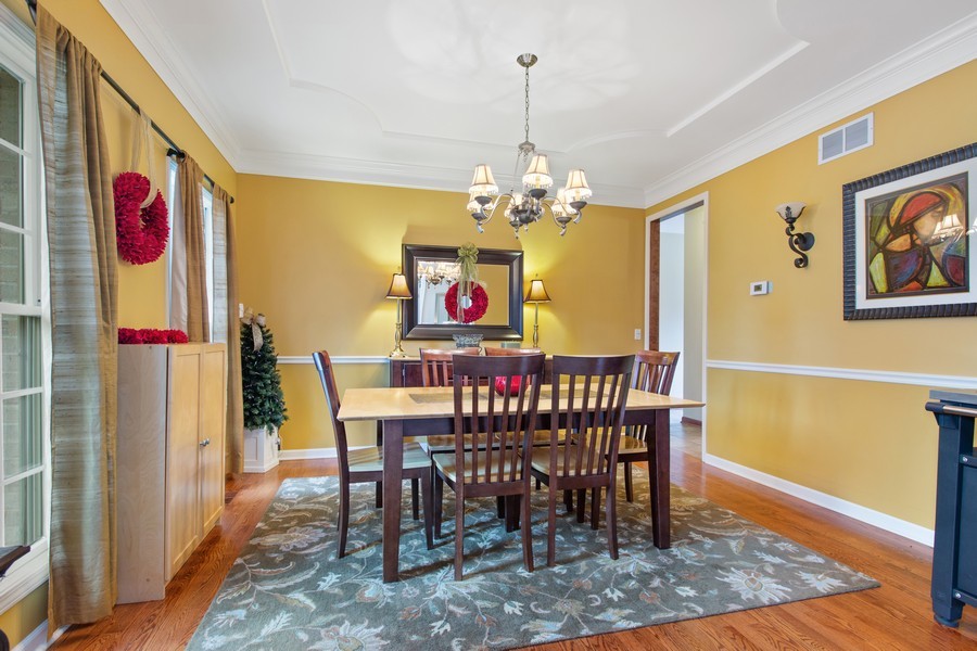 1 Walnut Lane Sugar Grove, IL 60554 - Photo 10 of 35 a view of a dining room with furniture wooden floor and a chandelier