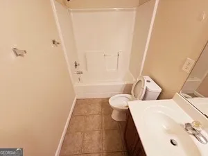 a bathroom with a bathtub and shower