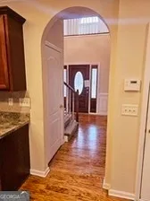 a view of a living room with a fireplace