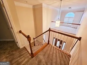 a view of a hallway with staircase