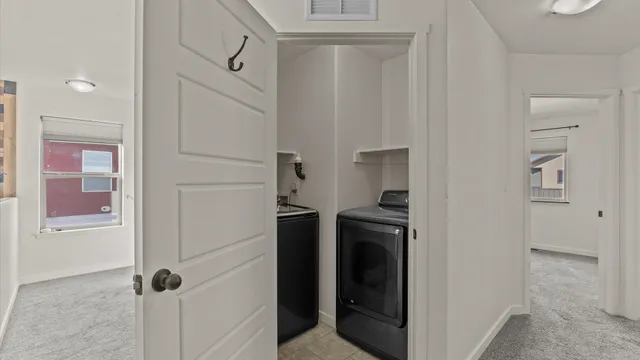 a view of a livingroom with furniture and a fan