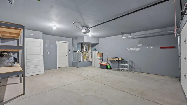a view of a patio with chair and tables back yard of the house