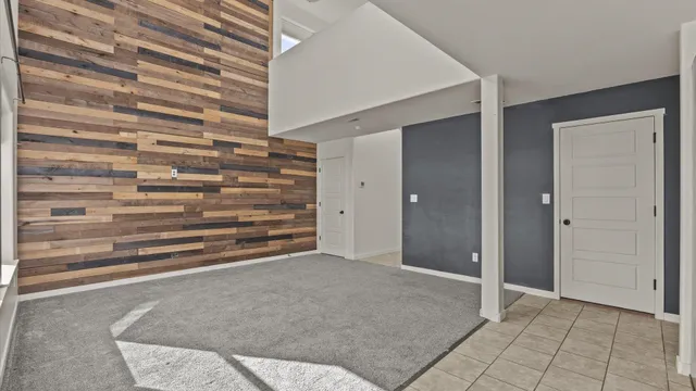 a view of an empty room with stairs and ventilation