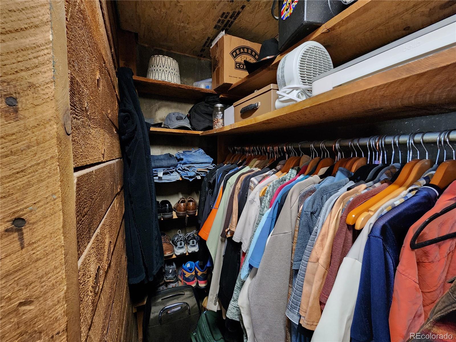 388 Clark Road Bailey, CO 80421 - Photo 22 of 50 a view of walk in closet with clothes and shoes
