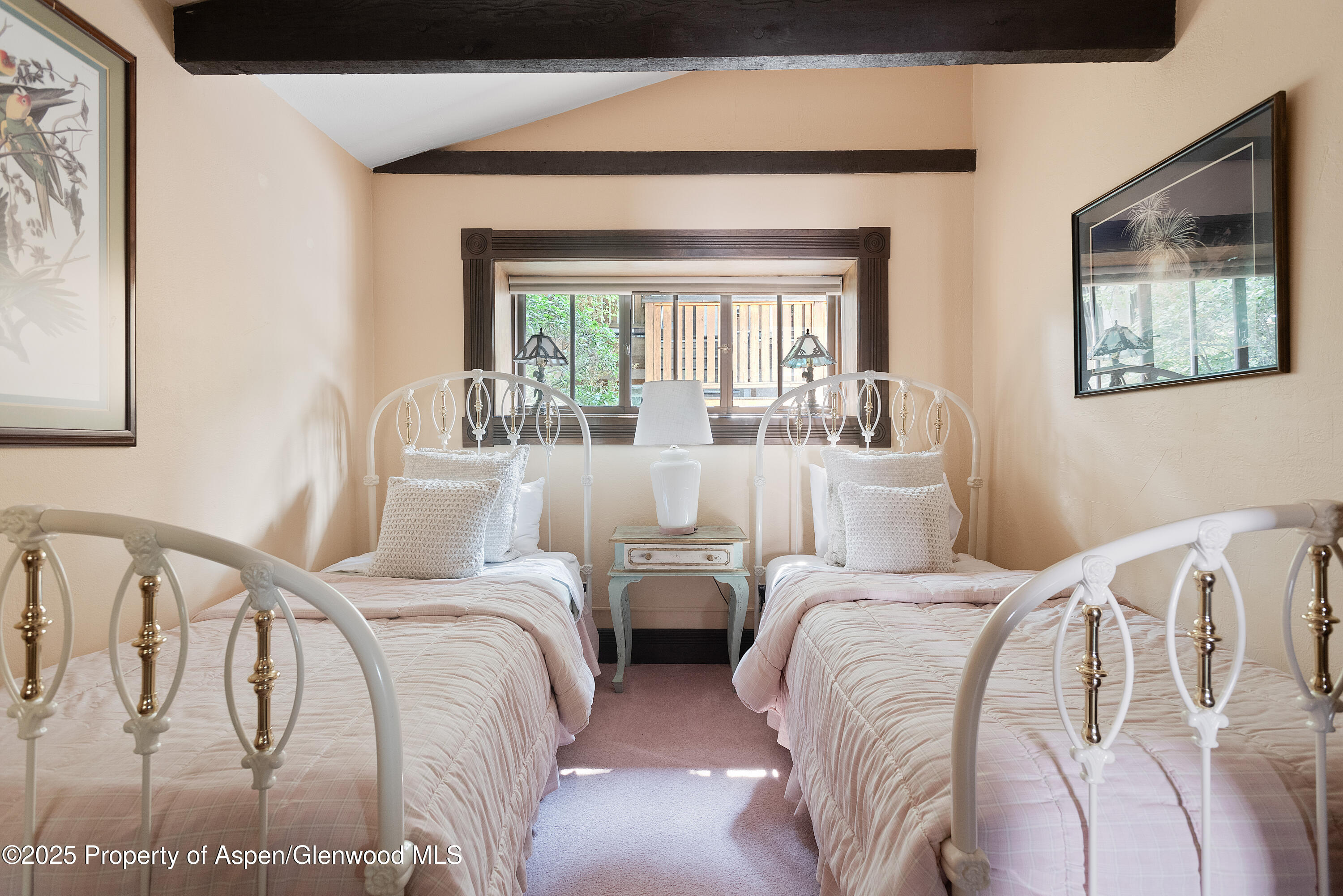 214 West Hyman Avenue Aspen, CO 81611 - Photo 12 of 21 a bedroom with two beds and a large window