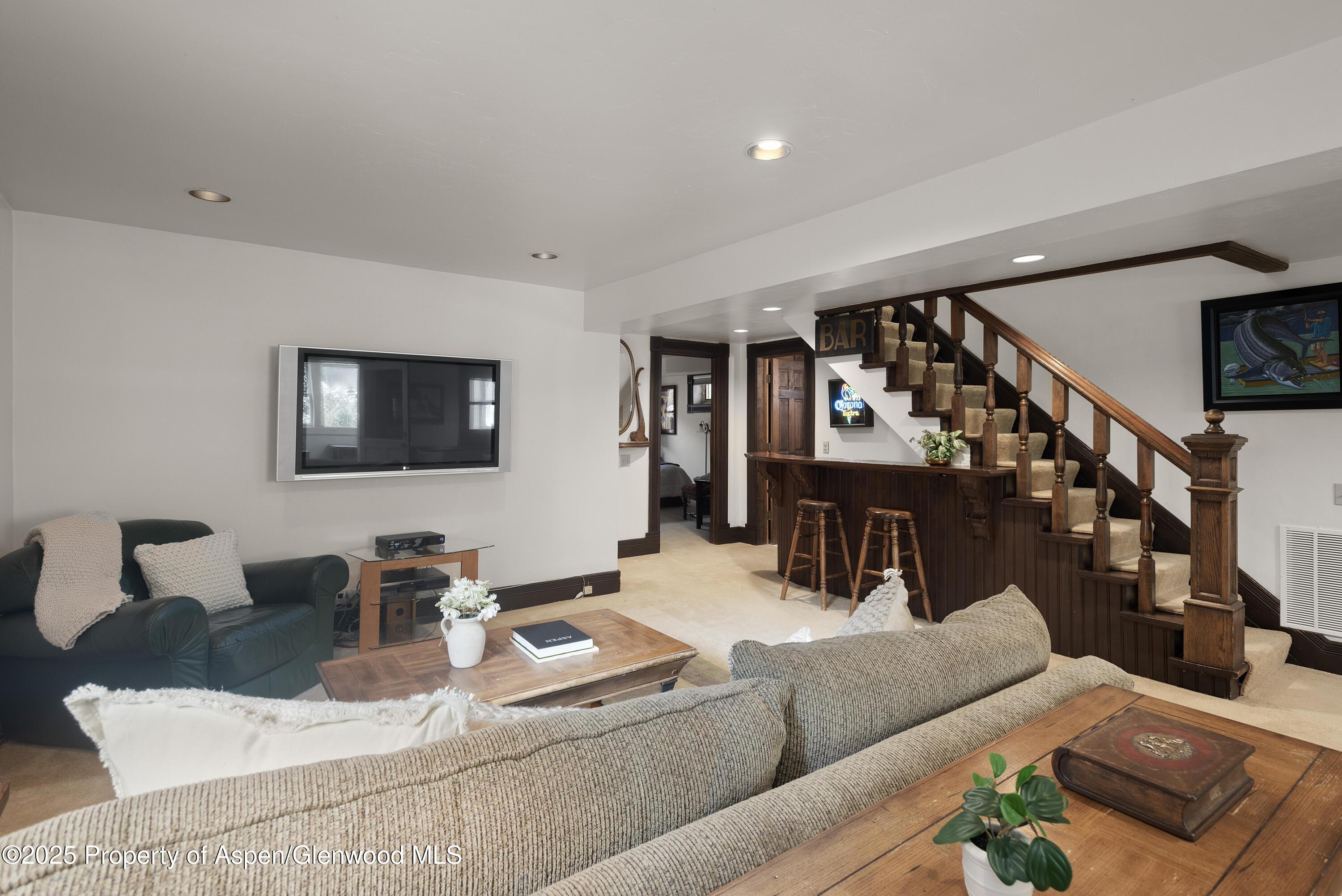214 West Hyman Avenue Aspen, CO 81611 - Photo 15 of 21 a living room with furniture and wooden floor