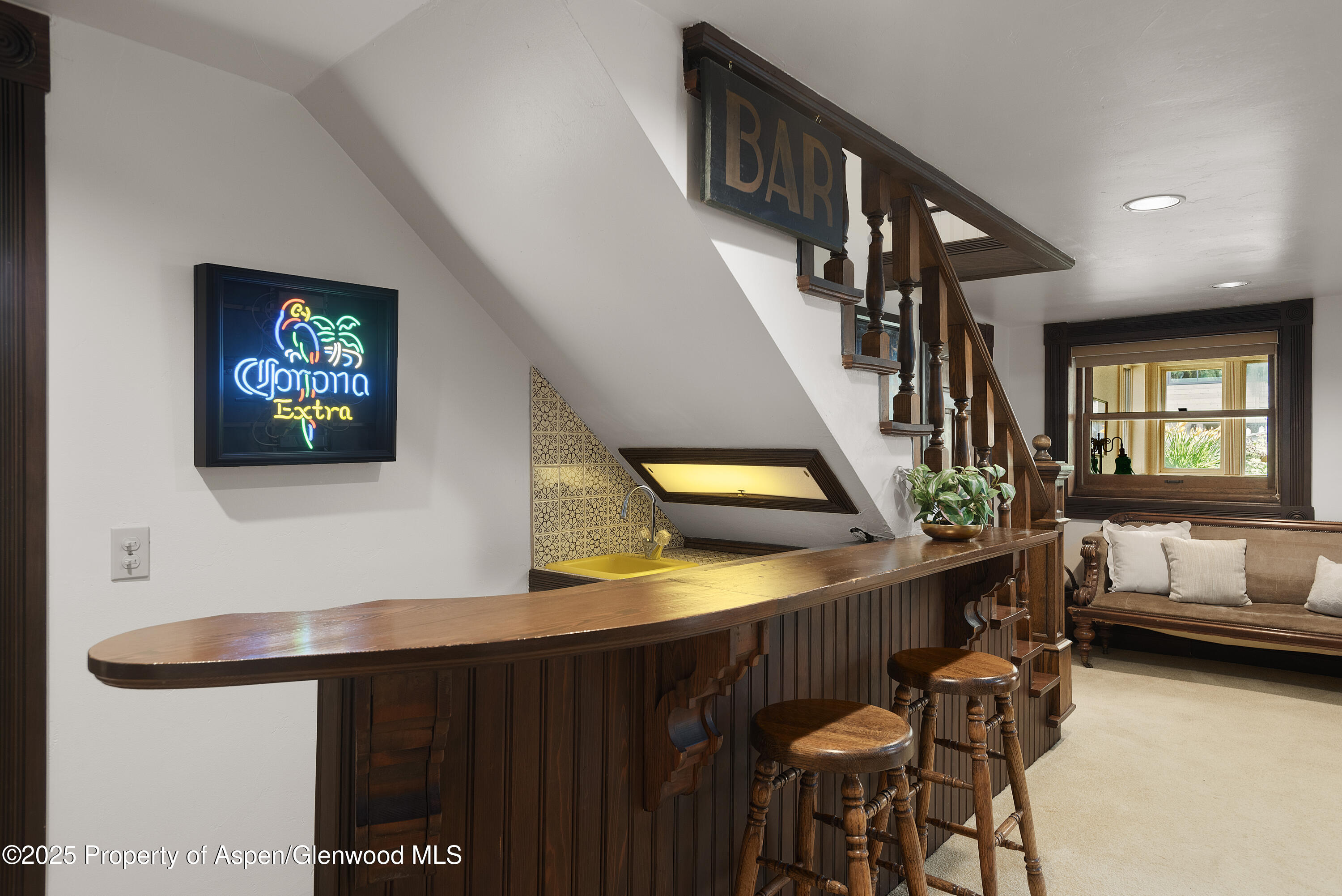 214 West Hyman Avenue Aspen, CO 81611 - Photo 16 of 21 a living room with furniture and a flat screen tv