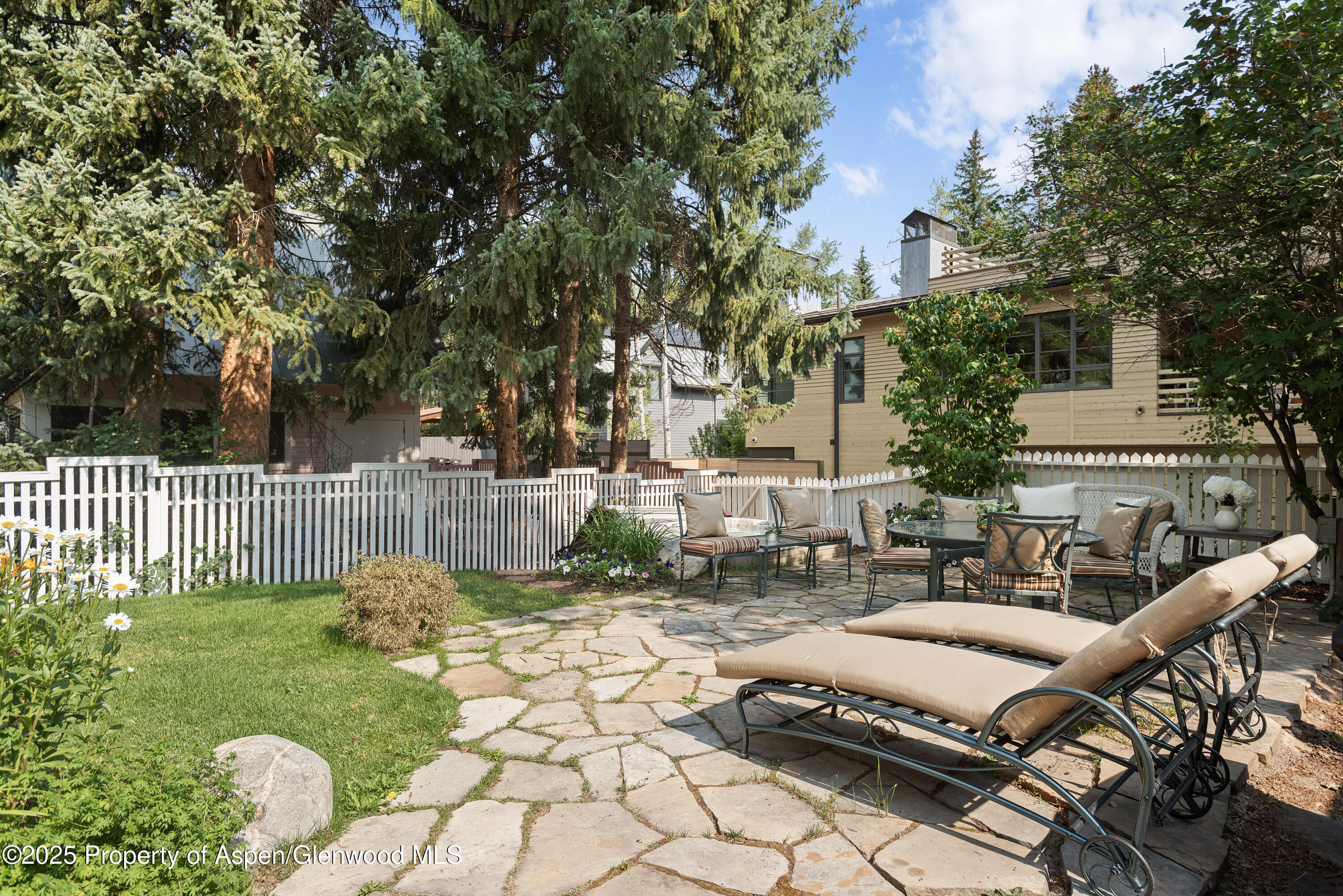 214 West Hyman Avenue Aspen, CO 81611 - Photo 21 of 21 a view of a patio with table and chairs and potted plants