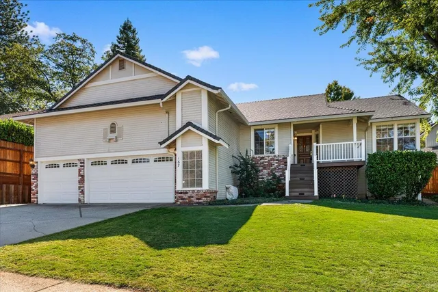 a front view of a house with a yard