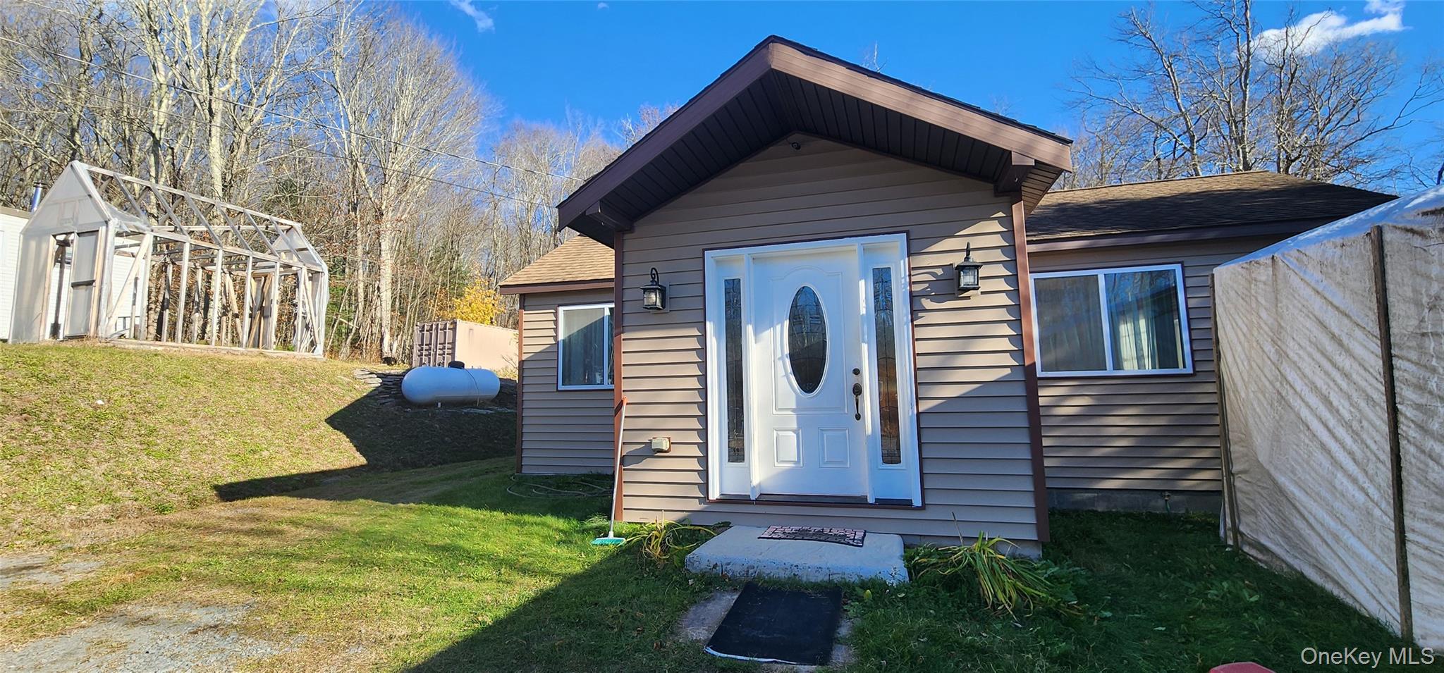 371 Kelly Bridge Road, Unit 365 Swan Lake, NY 12783 - Photo 10 of 21 a view of a house with a yard