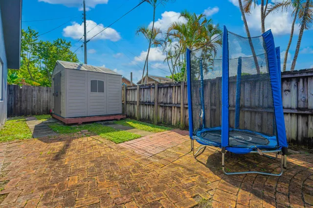 a view of a backyard with a tub