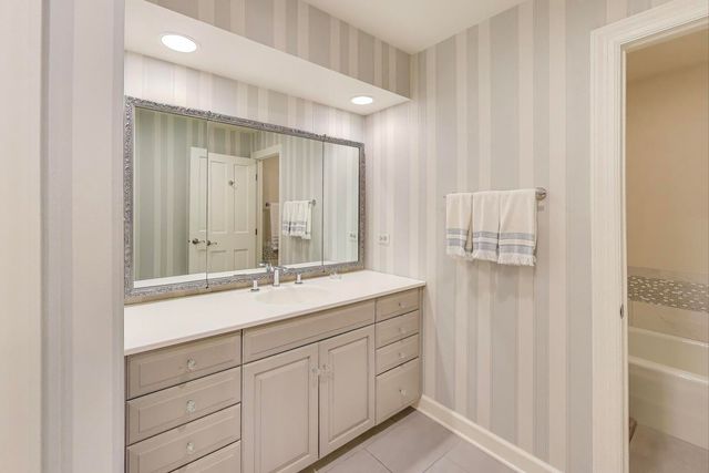 a bathroom with a shower and a bath tub