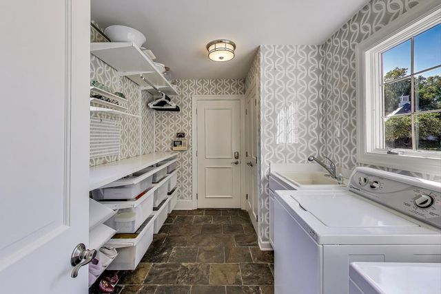 a view of a backyard with sitting area